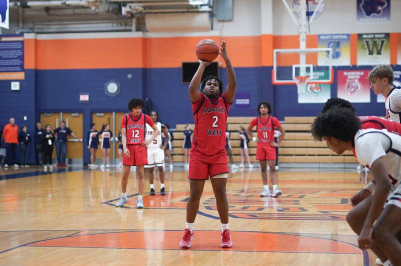 West Aurora's Calvin Savage (2) shoots a free throw against Oswego during a basketball game at Oswego High School on Friday, Dec 1, 2023.