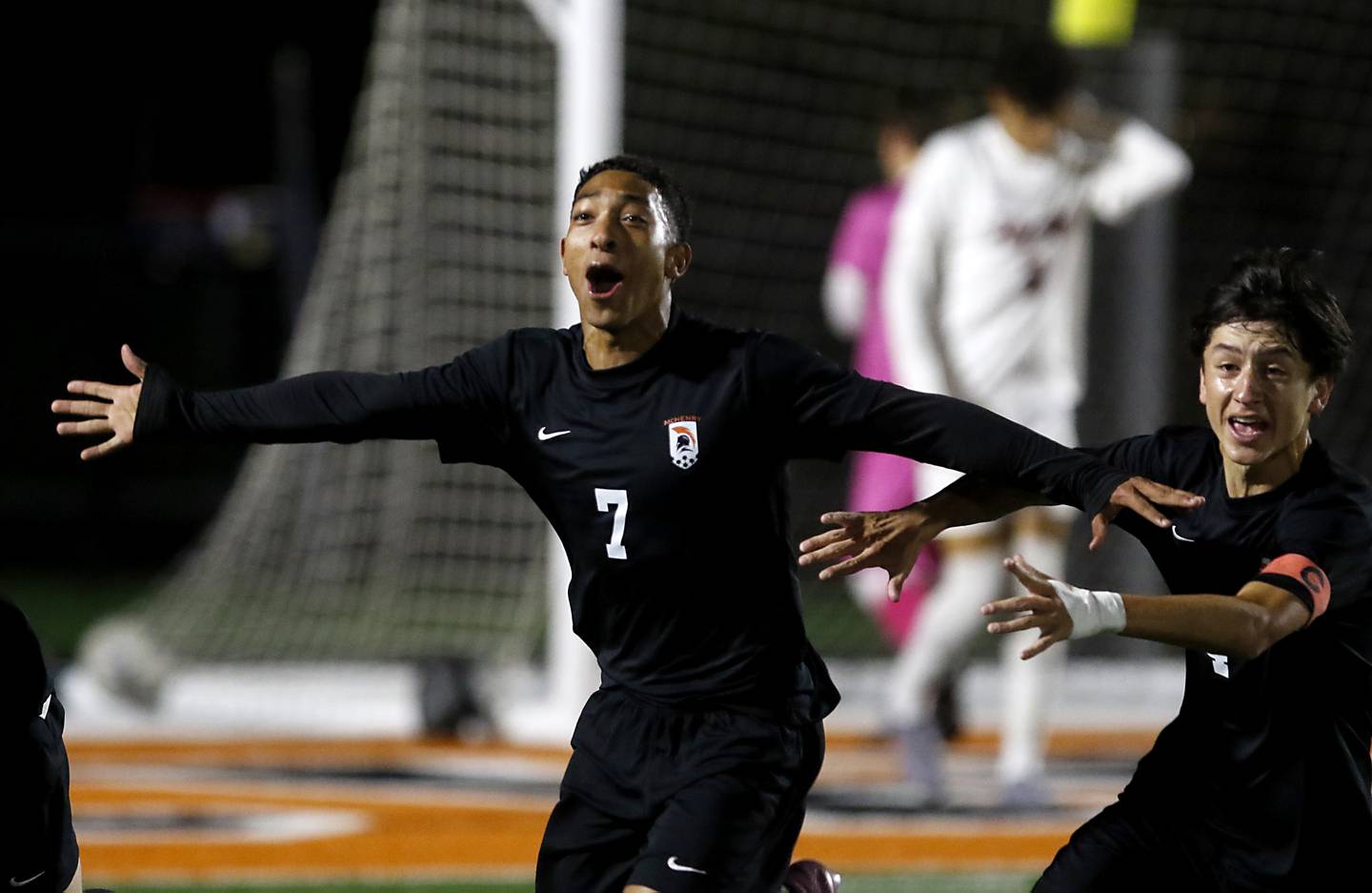 McHenry's Miguel Rondon celebrates his goal with teammate, Cole Tapia, during a Fox Valley Conference boys soccer match against Huntley on Thursday, Oct. 9, 2025, at McCracken Field in McHenry.