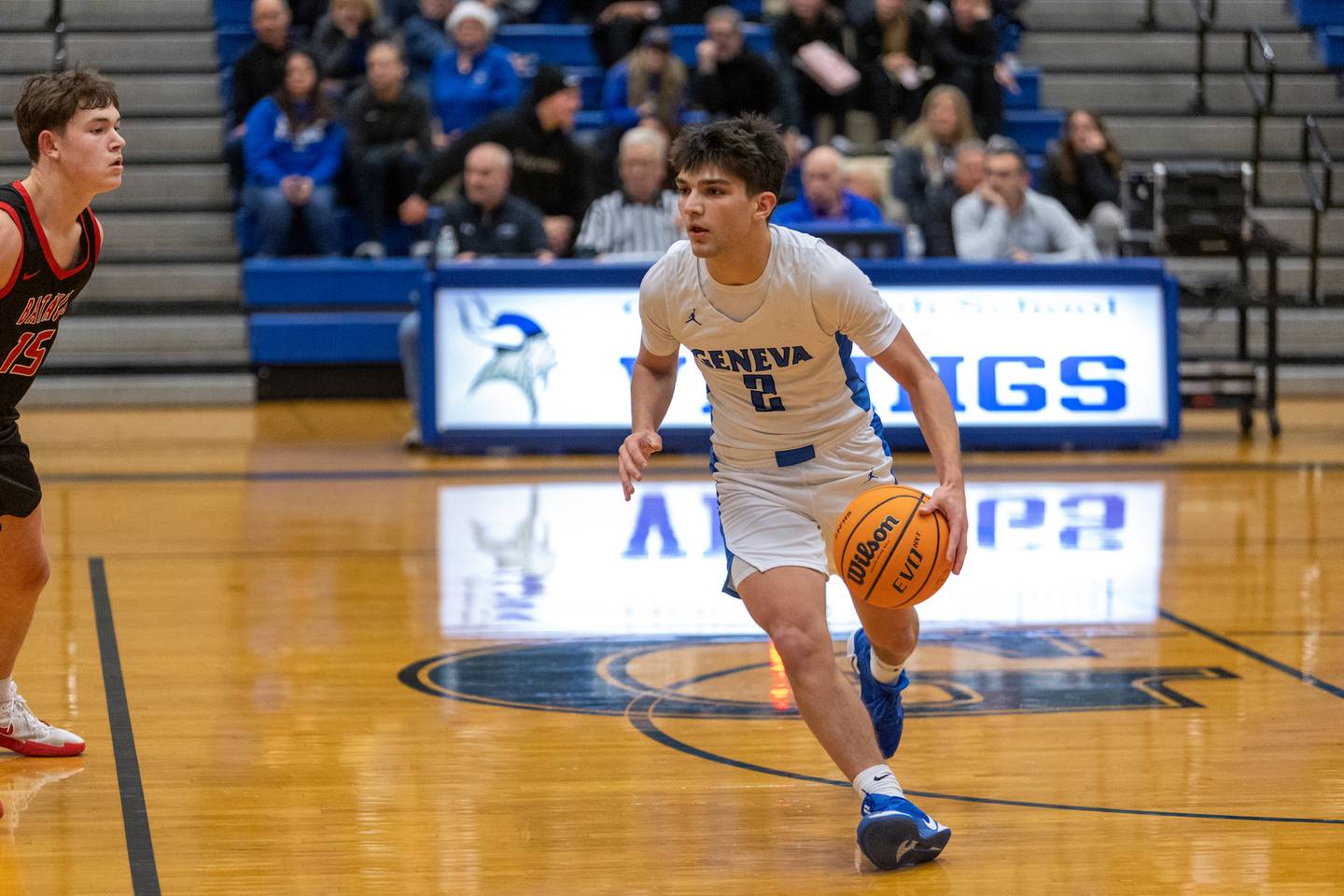 Geneva's Gabe Jensen sets a play in motion against Batavia on Friday, Dec.19,2025 in Geneva.