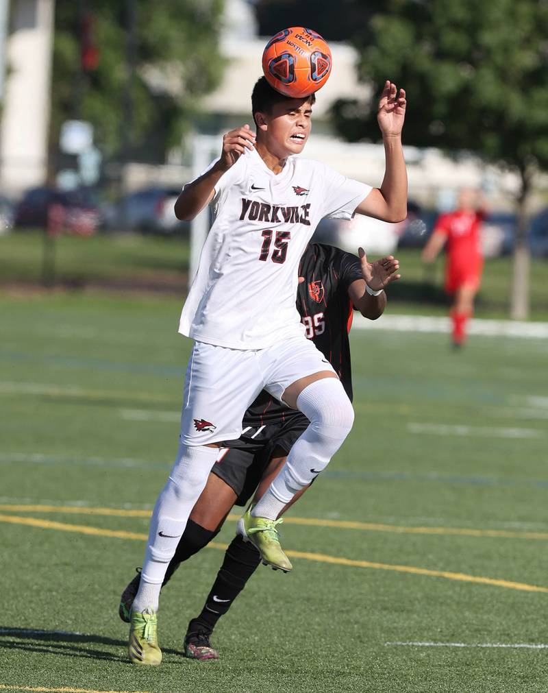 Yorkville's Mizael Terrazas heads the ball in front of DeKalb's Josiah Antimo during their game Thursday, Aug. 25, 2022, in the Barb Cup at the Northern Illinois University Outdoor Recreation Sports Complex.