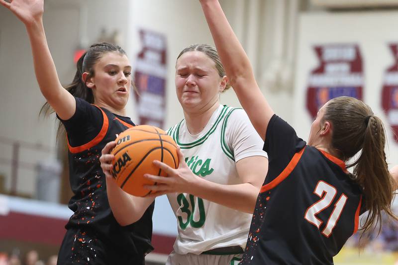 Providence’s Kennady Kotowski battles under the basket against Washington in the Class 3A Kankakee Super-Sectional game on Monday, March 3, 2026 in Kankakee.