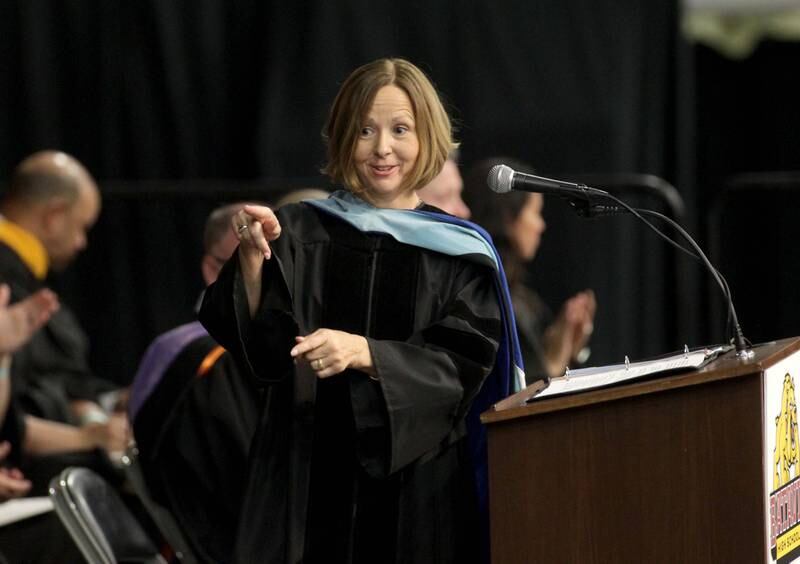 Batavia School District 101 Superintendent Lisa Hichens gestures to the class speakers during Batavia High School’s 2023 commencement ceremony at Northern Illinois University in DeKalb on Wednesday, May 24, 2023.