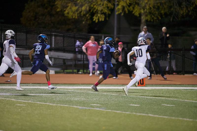 Downers Grove South's Kayden Smith runs for a touchdown against Addison Trail on Friday, Oct.20,2023 in Downers Grove.