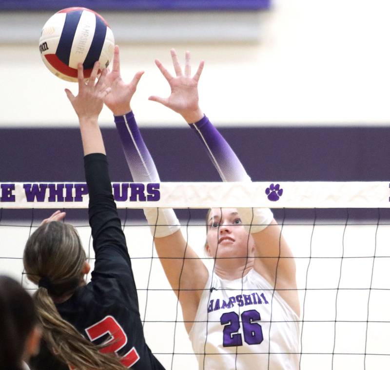Hampshire’s Anna Schiltz, right, blocks against Huntley in varsity girls volleyball at Hampshire High School in Hampshire on Tuesday, Sept. 23, 2025.