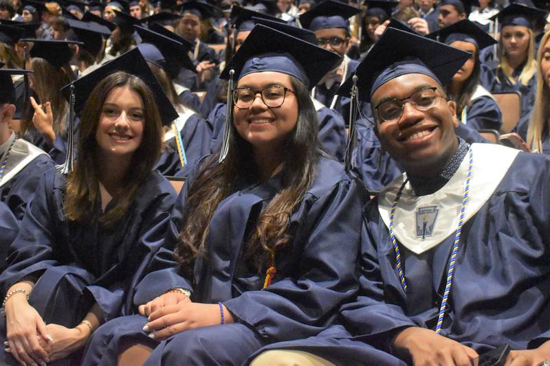Tate Vaughan, Alicia Villa, Addrian West during Nazareth Academy’s commencement ceremony in La Grange Park on Sunday, May 21, 2023.