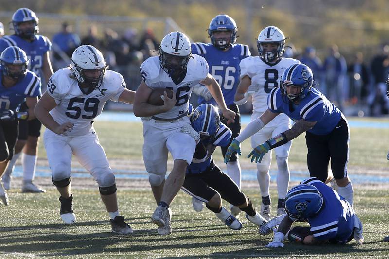 Cary-Grove's Logan Abrams runs through the Lake Zurich defense during a IHSA Class 6A semifinal playoff football game on Saturday, Nov. 18, 2023, at Lake Zurich High School.