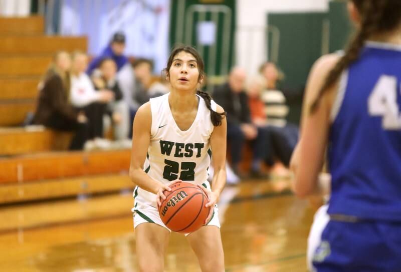 Glenbard West’s Sydney Nimsakont looks before shooting three points during a game against Lyons Township in Glen Ellyn on Tuesday, Dec. 12, 2023.