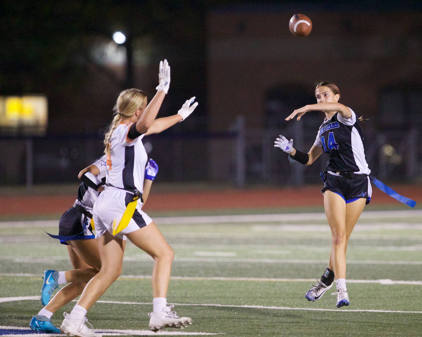 St. Charles North's Kaelie Tomalak throws the ball for a gain against St. Charles East on Monday, September 29, 2025 in St. Charles.