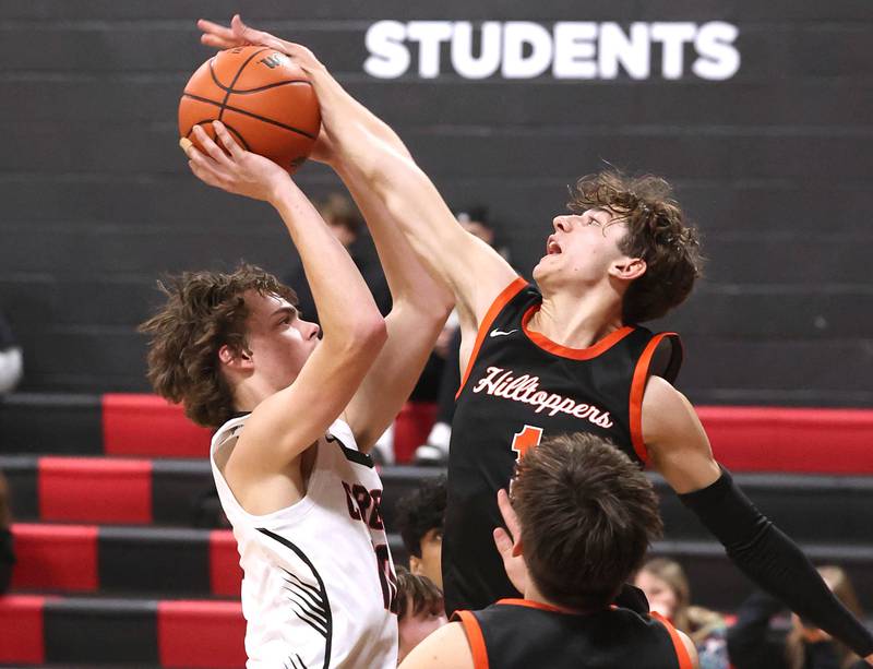 Elgin Academy's Chris Tacher blocks the shot of Indian Creek's Landon Schrader during their game Tuesday, Dec. 18, 2023, at Indian Creek High School in Shabbona.