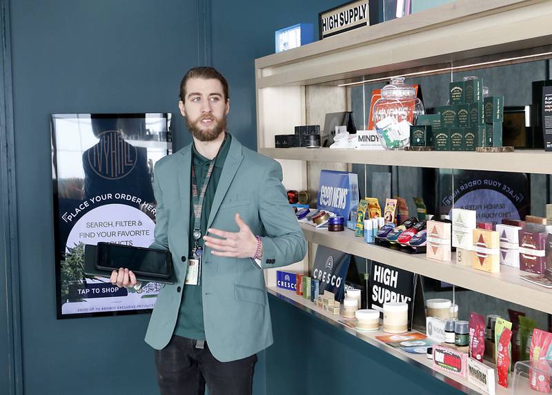 Zachary Edgerton, the general manager of the Ivy Hall Crystal Lake, gives a tour during an open house Thursday, Feb. 2, 2023, at the social equity-licensed marijuana dispensary that recently opened at 501 Pingree Road in Crystal Lake.