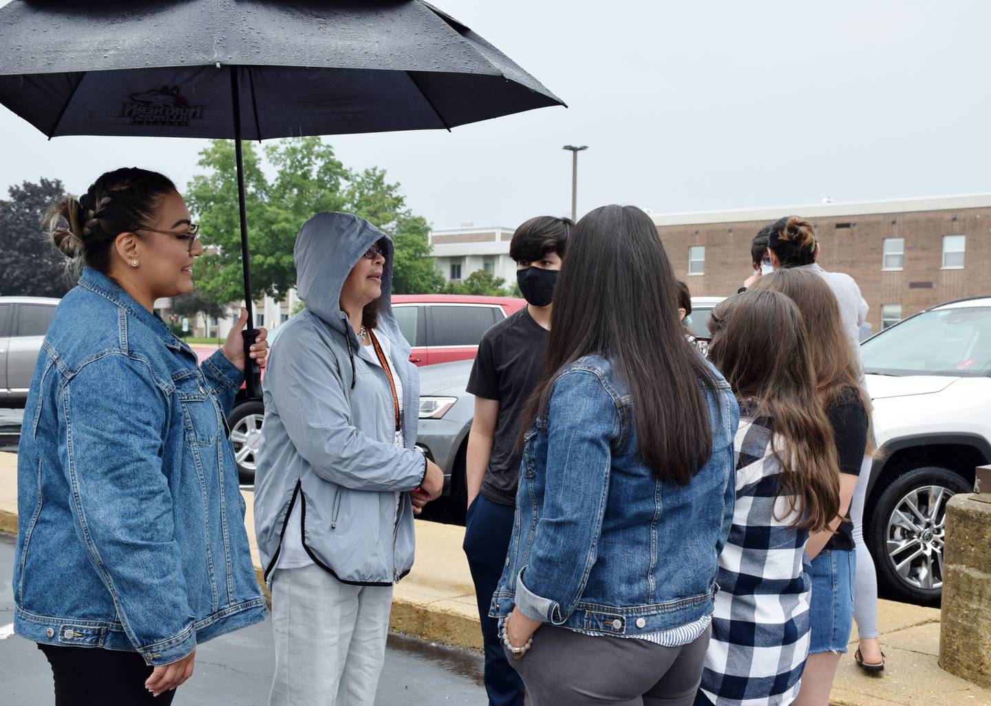 New DeKalb Superintendent Minerva Garcia-Sanchez, center, talks to a DeKalb family during an ice cream social event at Huntley Middle School on Wednesday, July 21.