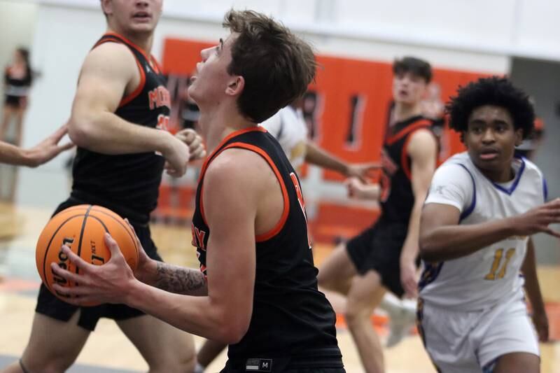 McHenry’s Caleb Jett works under the hoop against Warren in IHSA Class 4A Regional Title Game boys basketball action on Friday, Feb. 28, 2025 at McHenry High School in McHenry.