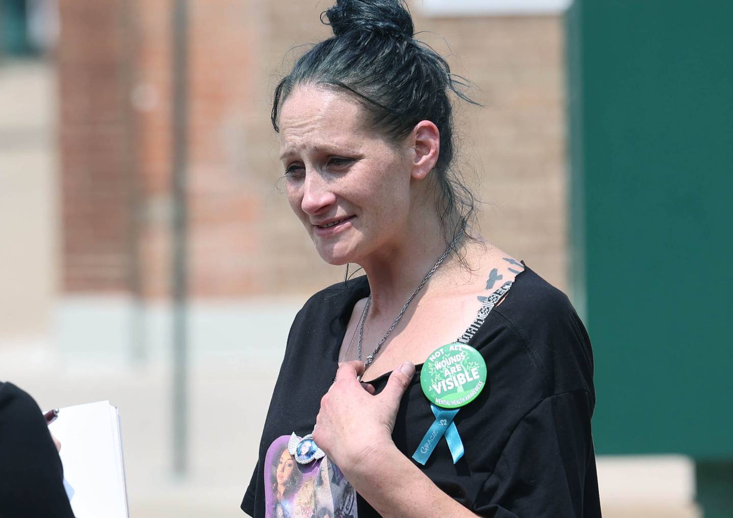 Ericka Sasso, of DeKalb, mother of slain teen Gracie Sasso-Cleveland, drops by a protest Wednesday, June 14, 2023, in front of the DeKalb County Courthouse in Sycamore. The protesters are asking for harsher sentences for those convicted of domestic or sexual abuse. They began shortly after the arraignment hearing of Timothy M. Doll, a registered sex offender charged with murder in DeKalb teen’s death.