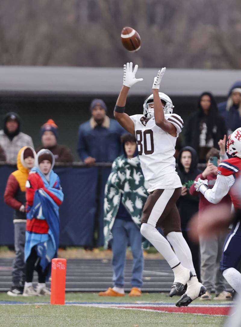Mt. Carmel's Marshawn Thorton (80) makes a touchdown reception during the class 7A semi-final playoff game between Mt. Carmel and St. Rita high schools on Saturday, Nov. 23, 2024 in Chicago.