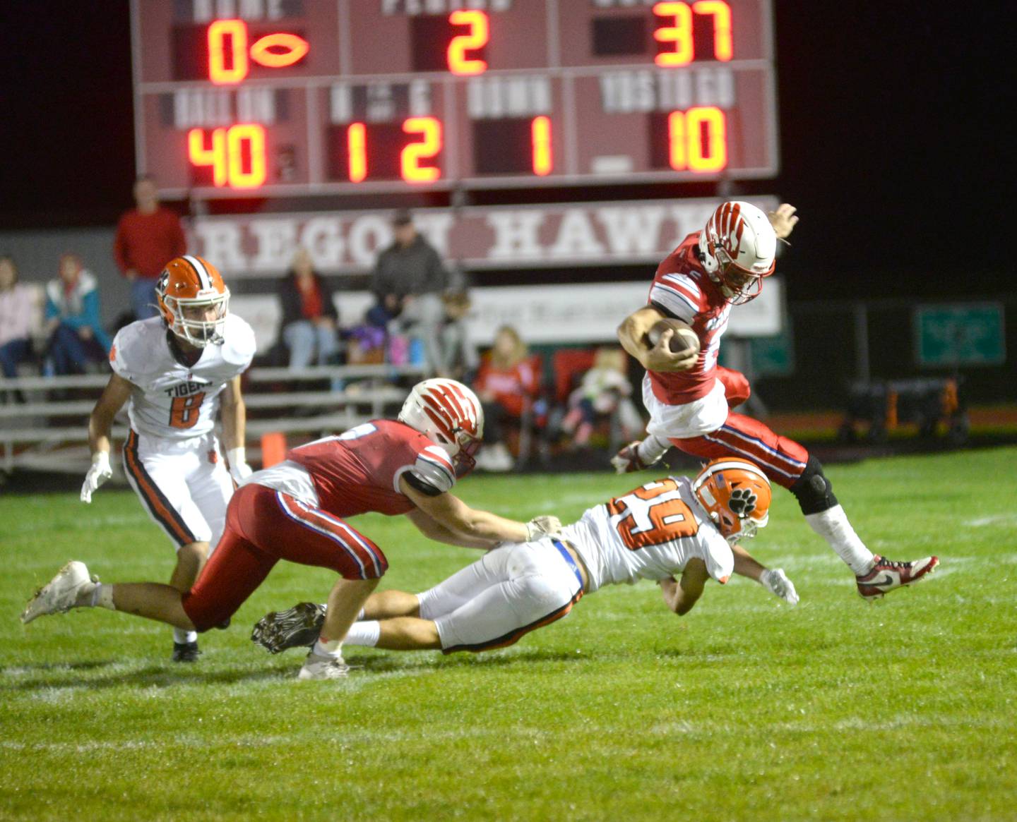 Oregon Austin Egyed (2) is knocked off his feet by Byron's Kye Aken (29) as he tries to return a kickoff during Friday, Sept. 22, 2023 action at Landers-Loomis Field.