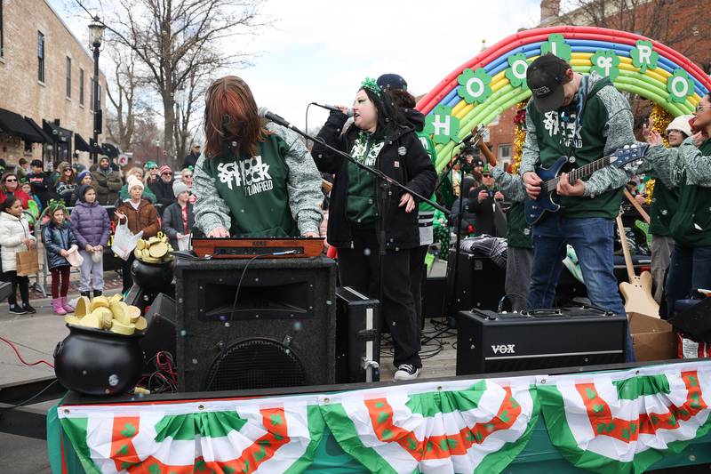 Plainfield’s School of Rock performs from a float at the Plainfield Hometown Irish Parade on Sunday, March 17, 2024 in Plainfield.