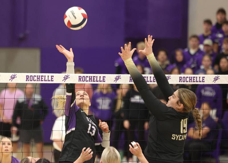 Dixon’s Solis Thompson tries to tip the ball over Sycamore's Isabella Culotta Thursday, Oct. 30, 2025, during their Class 3A regional championship match in Rochelle.