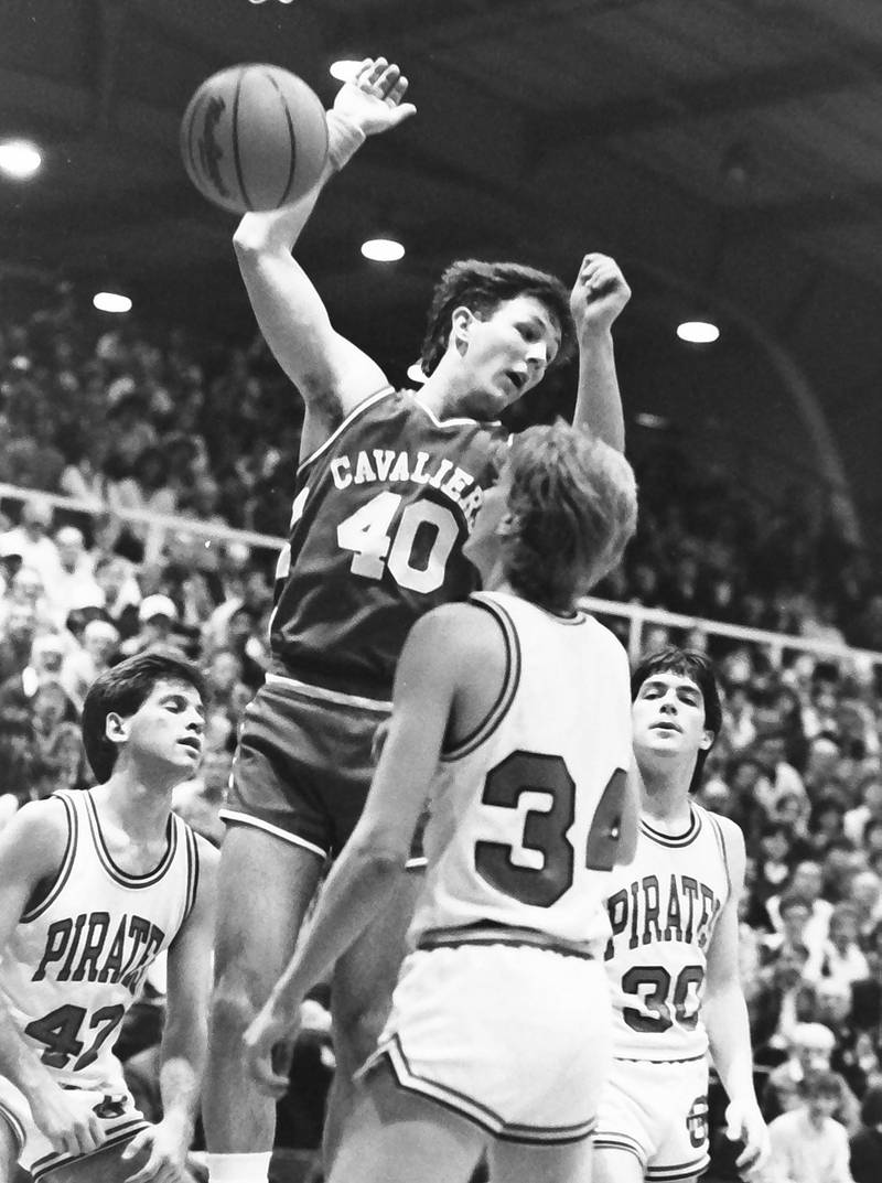 L-P's Jim Bacidore scores on a layup over Ottawa's (from left) Rick Hayne, Dave Yell and Dewey Gould during the Regional title game on Saturday, Feb. 28, 1986 at La Salle-Peru Township High School.