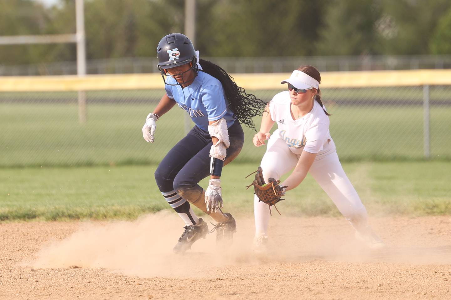 Nazareth’s Kennedy Joe slides into second ahead of the tag by Joliet Catholic’s Molly Ryan on Wednesday, May 1, 2024 in Joliet.