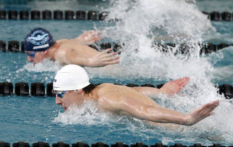 Cary-Grove’s Kasparas Venslauskas (foreground) and D300 Co-op’s Luke Johnson compete in the 200 IM during the Fox Valley Conference Invitational swim meet on Saturday,  Feb. 15, 2025, at Woodstock North High School.