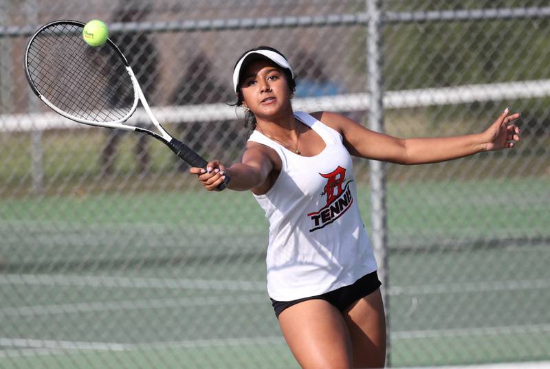 DeKalb’s Preeti Islam hits a shot during her doubles match against Sycamore Wednesday, Sept. 18, 2024, at Sycamore High School.