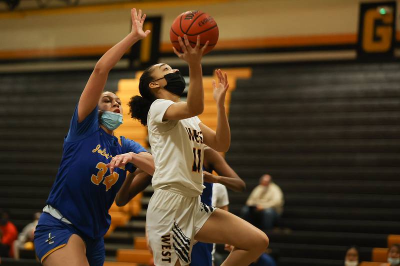 Joliet West’s Caiside Snapp goes in for the layup against Joliet Central. Tuesday, Feb. 8, 2022, in Joliet.