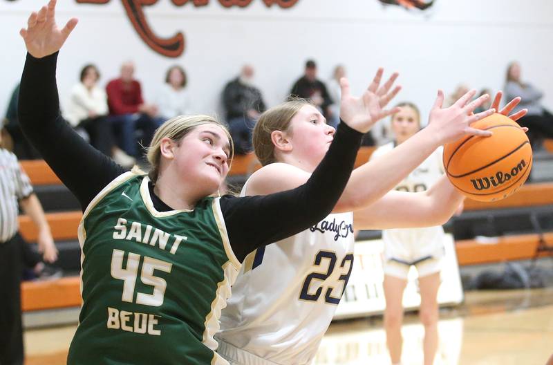 Marquette's Kelsey Cuchra grabs a rebound over St. Bede's Savannah Bray during the Tri-County Conference championship game on Thursday, Jan. 23, 2025 at Roanoke-Benson High School.
