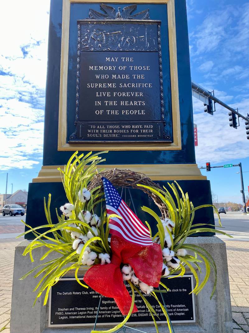 A ceremonial wreath was laid at the base of the Soldiers' and Sailors' Memorial Clock in downtown DeKalb Saturday, Nov. 11, 2023 to honor military service men and women during the DeKalb American Legion Post No. 66's annual Veterans Day ceremony.