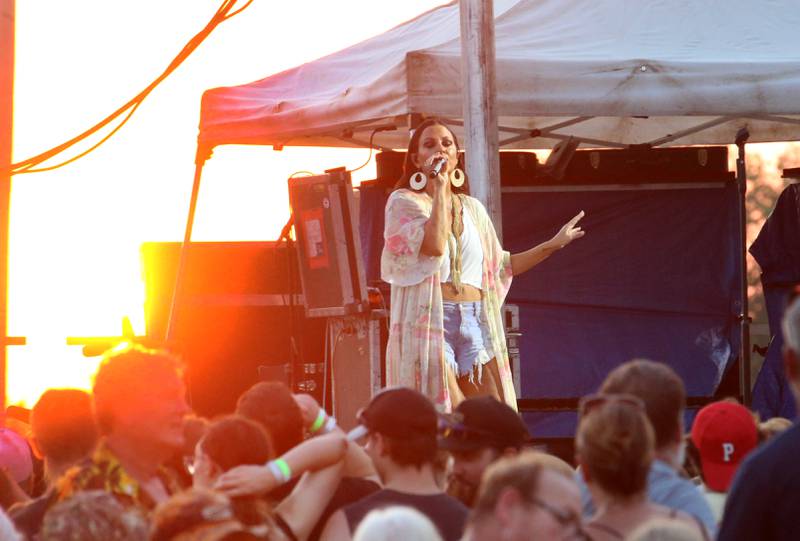 The sun sets behind Country Music star Sara Evans on Thursday, Aug. 24, 2023 at the Bureau County Fair in Princeton.