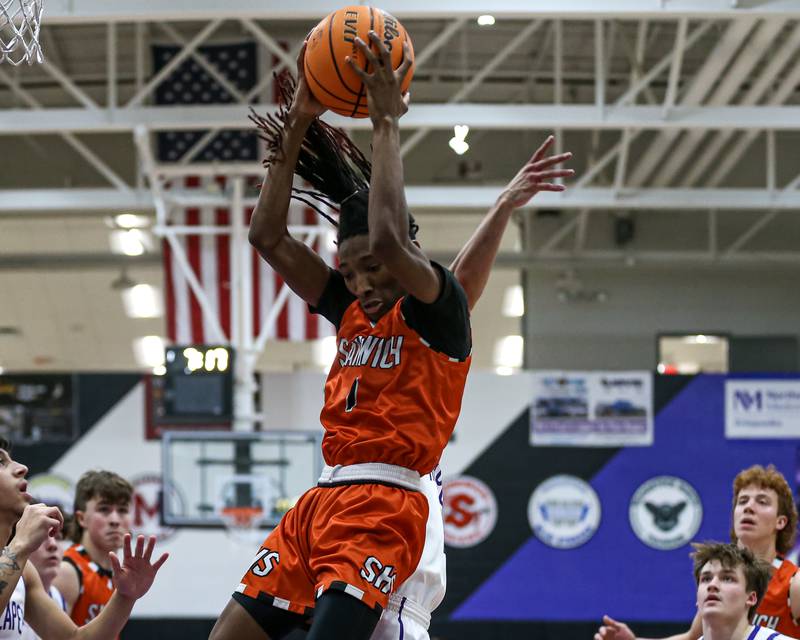 Sandwich's Simeion Harris (1) comes down with a rebound during their basketball game between Sandwich at Plano. Jan 27, 2025 in Plano.