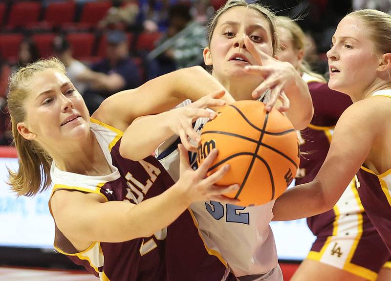 Nazareth's Stella Sakalas goes after a rebound with Loyola's Marycait Mackie during the Class 4A State girls basketball championship game on Saturday, March 7, 2026 at CEFCU Arena in Normal.