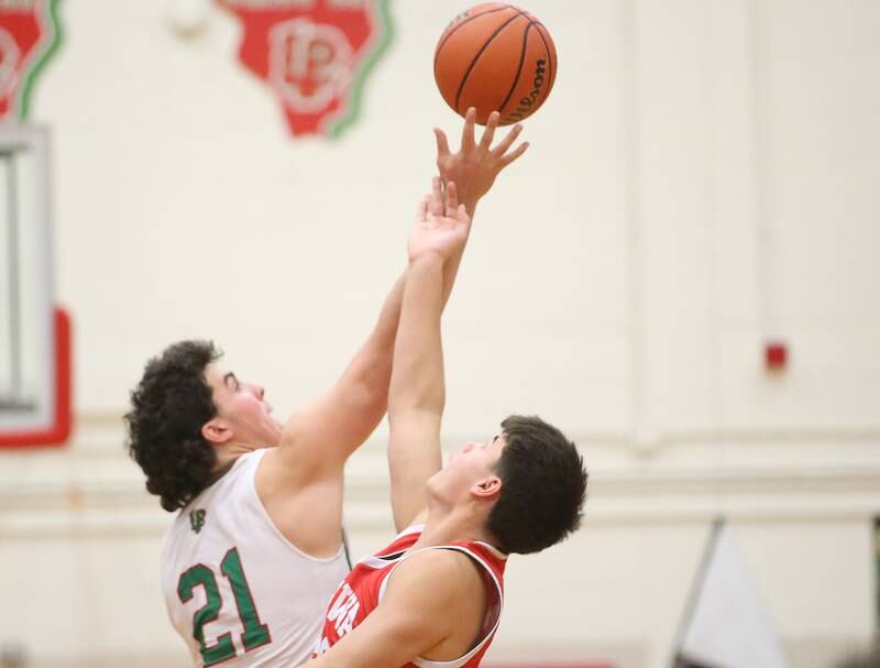 L-P's Josh Seneca wins the opening jump ball over Ottawa's Cooper Knoll on Friday, Jan. 5, 2023 at Sellett Gymnasium.