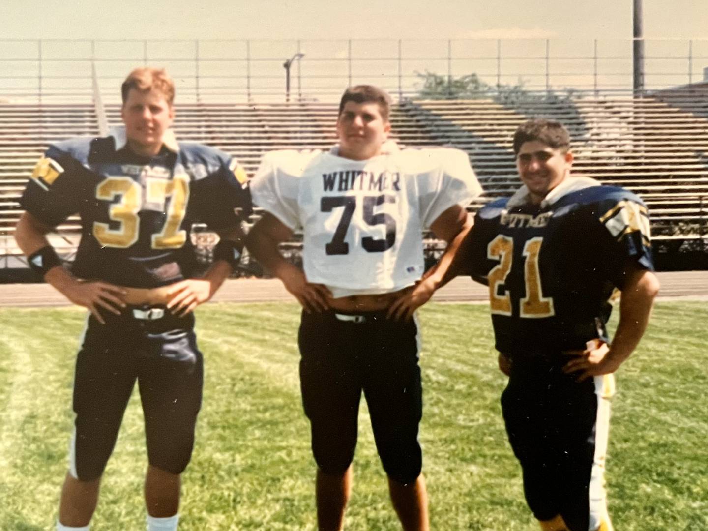 Whitmer High School football players and cousins (from left) Matt Eberflus, Tony Bardwell and George Bardwell pose for a photo.