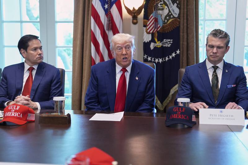President Donald Trump speaks during a cabinet meeting at the White House, Wednesday, April 30, 2025, in Washington, as Secretary of State Marco Rubio, left, and Secretary of Defense Pete Hegseth, look on. (AP Photo/Evan Vucci)