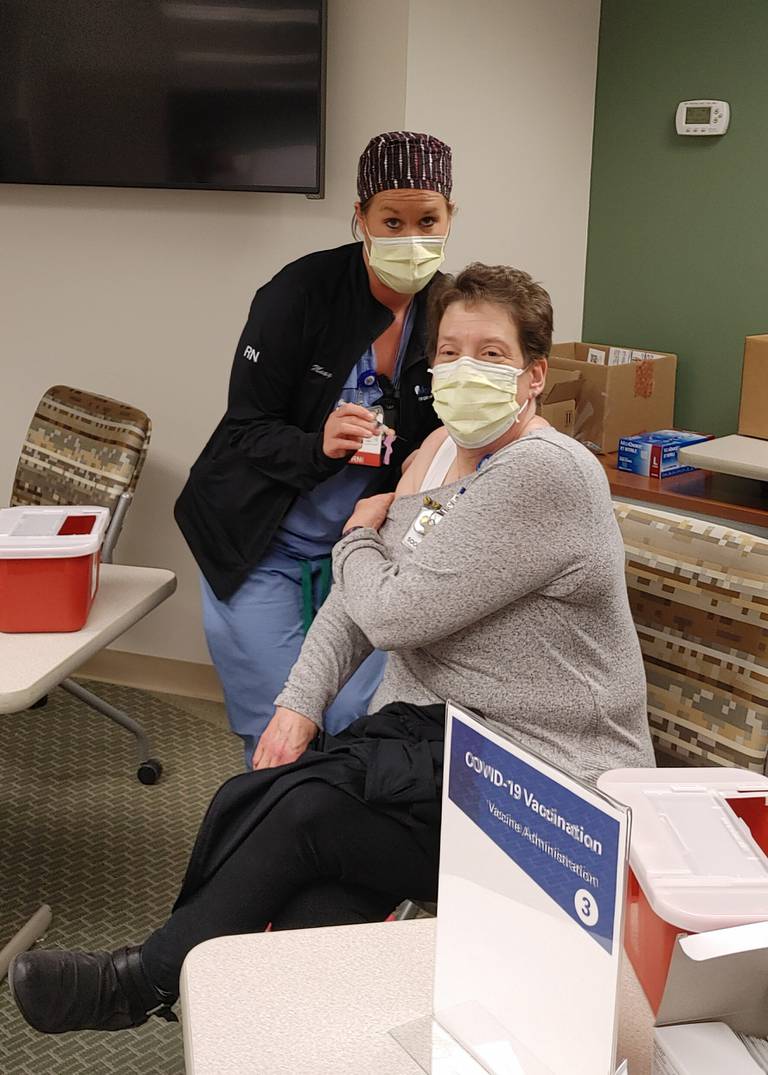 Penny Goad, a social worker at Mercyhealth Care Center in Harvard, was the first at the hospital to receive the COVID-19 vaccine Tuesday, Dec. 29, 2020.