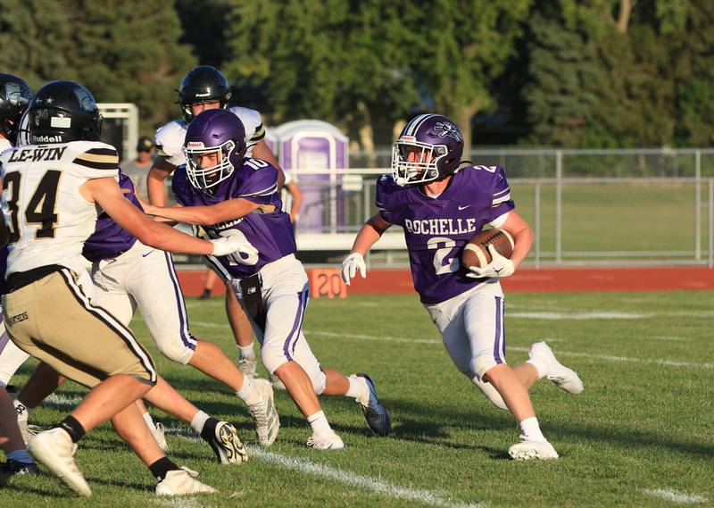 Rochelle's Luke Chadwick (2) runs the ball during a JV football game with Lena-Winslow on Friday, Sept. 12, 2025.