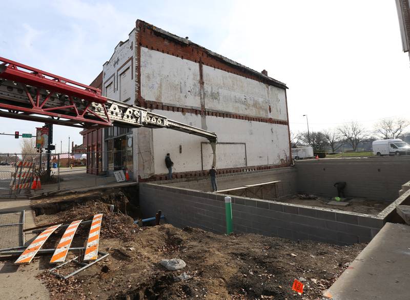 Crews pour the foundation of a new building at 205-207 W. Main St on Friday, Dec. 8, 2023 downtown Ottawa. The city had to close off Main Street in order to complete the pour.