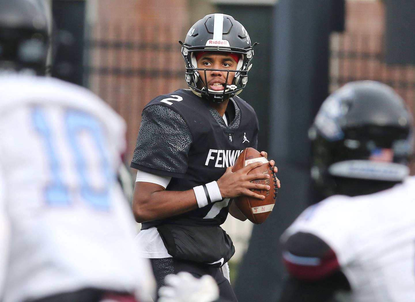 Fenwick's Kaden Cobb looks for an open receiver on the Kankakee secondary during the Class 5A state championship Saturday, Nov. 27, 2021, in Huskie Stadium at Northern Illinois University in DeKalb.