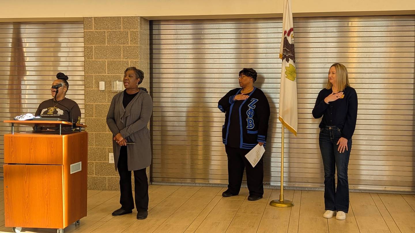 Two members of Mt. Zion Baptist Church in Joliet led attendees in singing "The Star-Spangled Banner" and "Lift Up Your Voice at the 17th MLK Day of Service kickoff event on Monday, January 20, 2025 at Joliet Central High School, while MLK co-chairs (from left) Ericka Williams and Kristine Schlismann join in the singing.