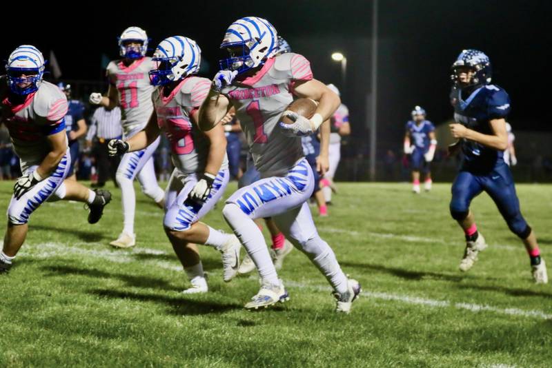 Princeton's Casey Etheridge races for a long gainer at Bureau Valley Friday night. He scored three touchdowns in the Tigers' 42-0 win over the rival Storm.