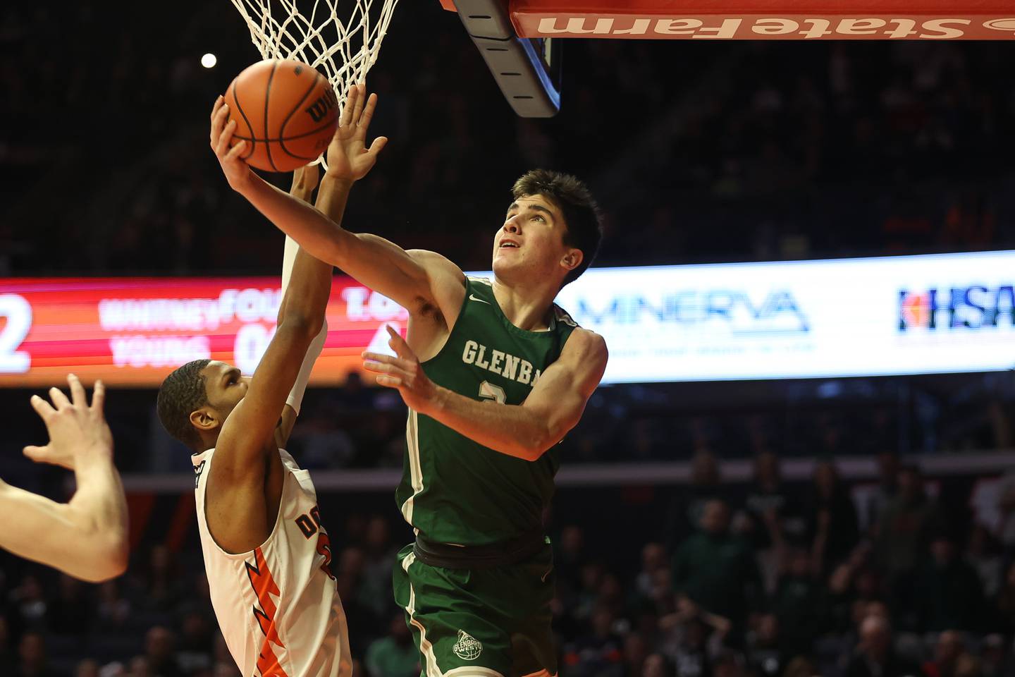 Glenbard West’s Paxton Warden puts up a windmill layup against Whitney Young in the Class 4A championship game at State Farm Center in Champaign. Saturday, Mar. 12, 2022, in Champaign.