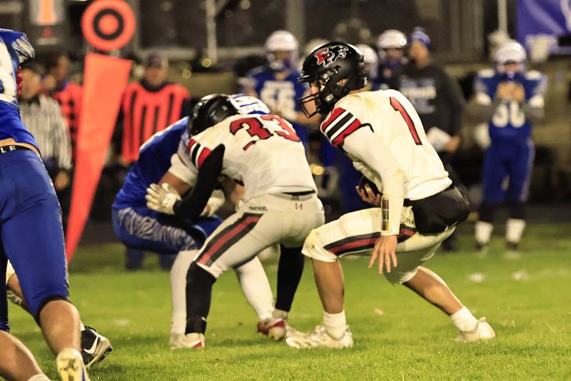 EP's #33 sophomore Noah Wetzell blocks for senior QB Keegan Winckler in their last regular season game against the Tigers in Princeton.