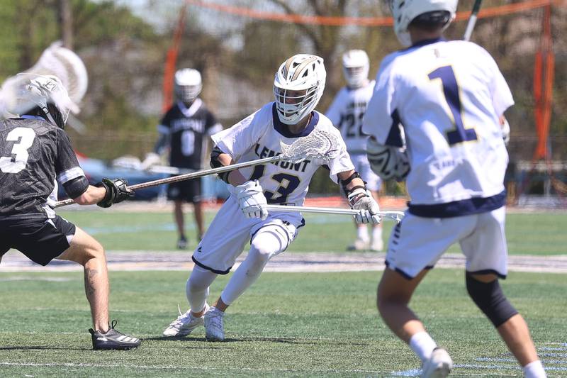 Lemont’s Antoni Mierzwa works to get an open shot against Lincoln-Way on Saturday, April 25, 2026 in Lemont.
