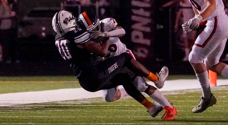 Plainfield North's Benjamin Schifo (29) tackles Oswego’s Noah Vera (26) during a football game at Plainfield North High School on Friday, Sept. 22, 2023.