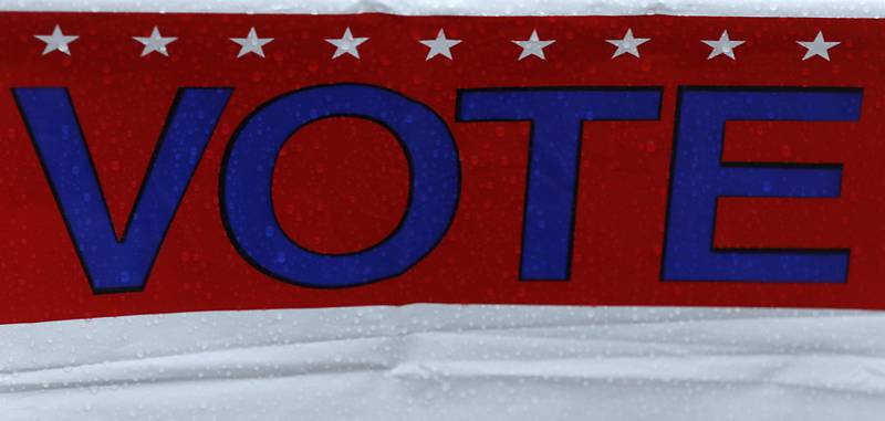 Raindrops on a vote sign on Tuesday, Nov. 5, 2024, at the Johnsburg Public Library.