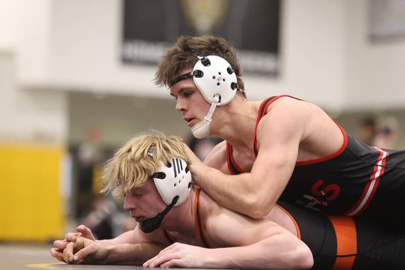 Bolingbrook’s Tommy McDermott works over Minooka’s Kaden Meyer in the 165-pound weight SPC Conference championship match at Joliet West on Saturday, Jan 25, 2025.