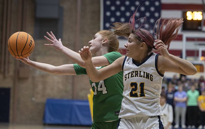 Alleman’s Emilye Polich snags a rebound in front of  Sterling’s Jaelynn James Thursday, Jan. 29, 2026.