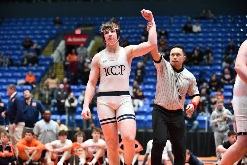 Anthony Sebastian of IC Catholic celebrates his 285-pound victory over Sean Thornton of Washington during the IHSA Dual Team State Finals in Bloomington on Saturday, March 1.