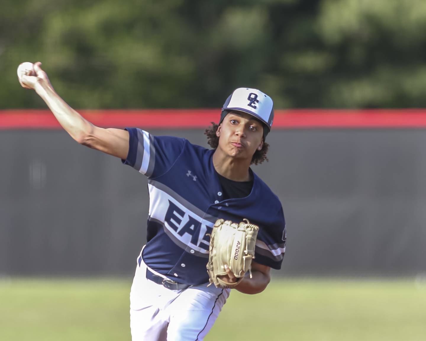 Oswego East's Carter Davis (13) delivers a pitch during baseball game between Oswego East at Yorkville. Monday, May 12, 2025 in Yorkville.