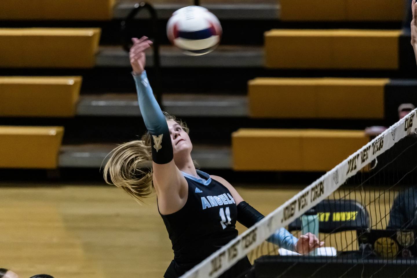 Joliet Catholic's Ella Horn makes a move at the net during a varsity volleyball game against Joliet West at Joliet West Sept. 4, 2025.